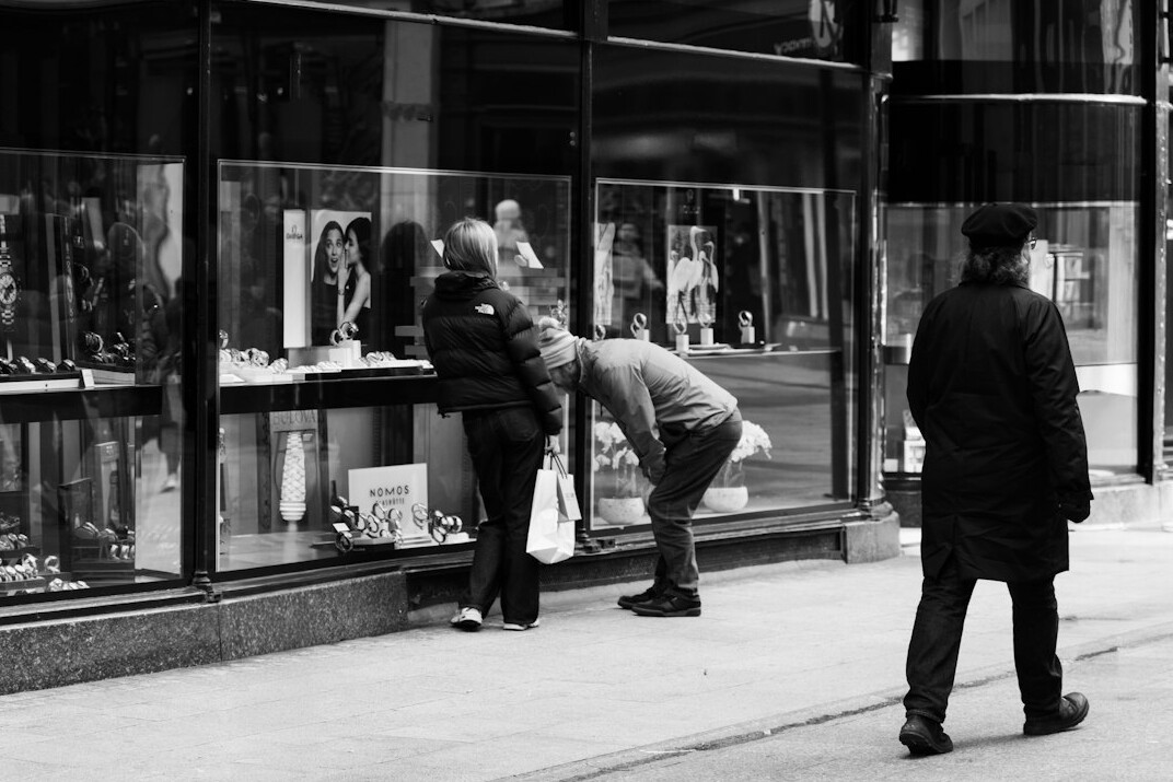 store detective watching shoppers